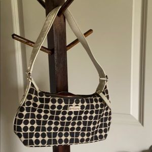 Kate Spade hand bag with off white patent short strap and black geometric design